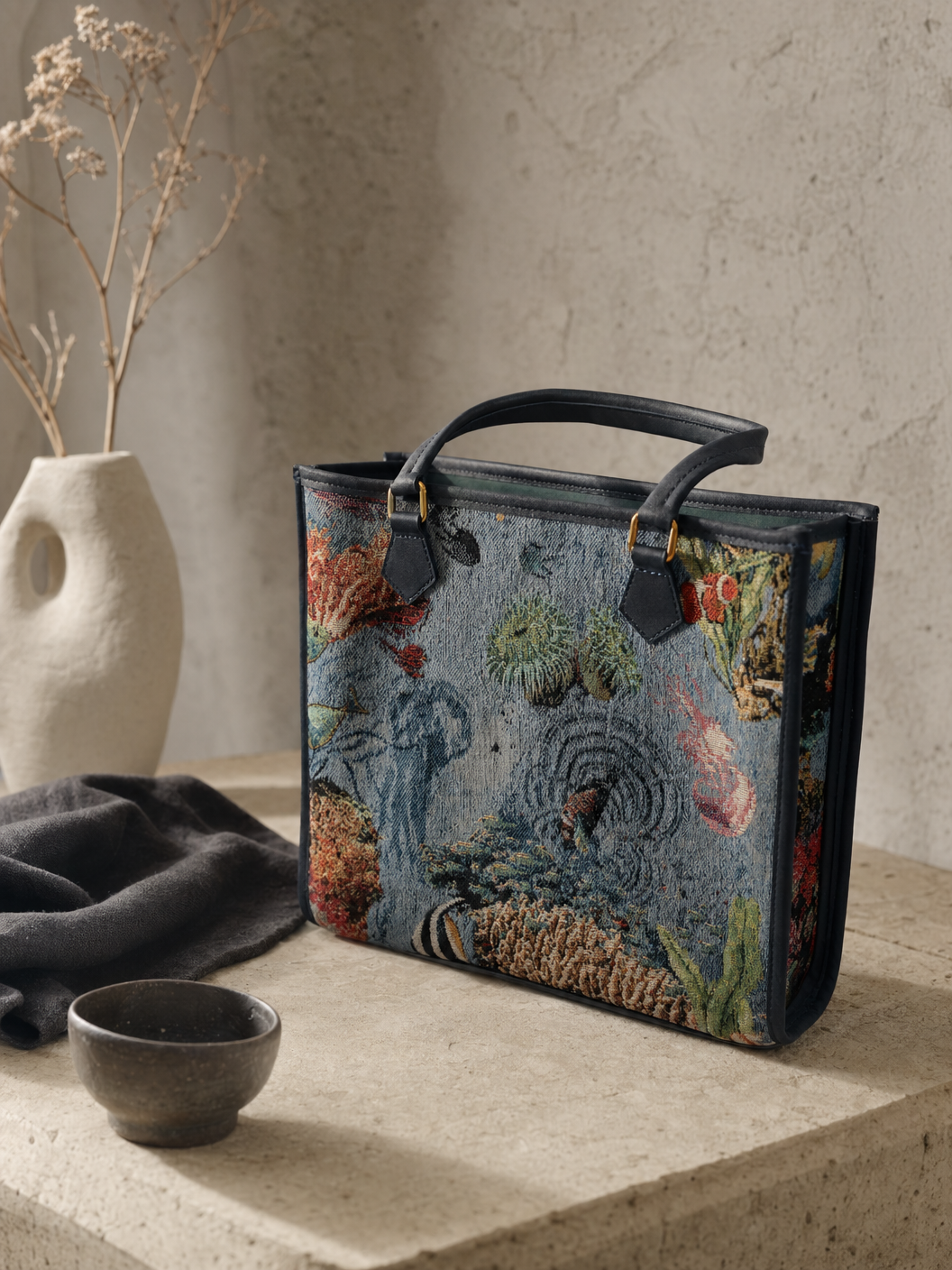 Structured navy tapestry tote with gold hardware